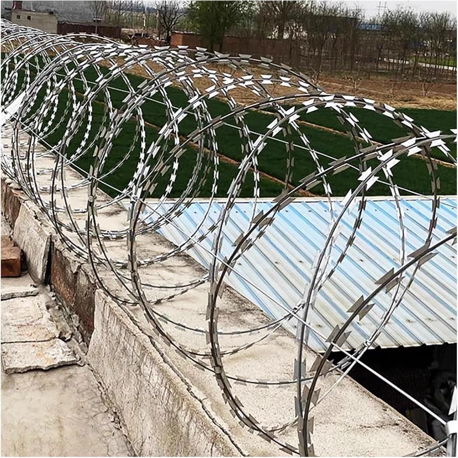 Professional razor wire installation on residential compound wall in Kenya