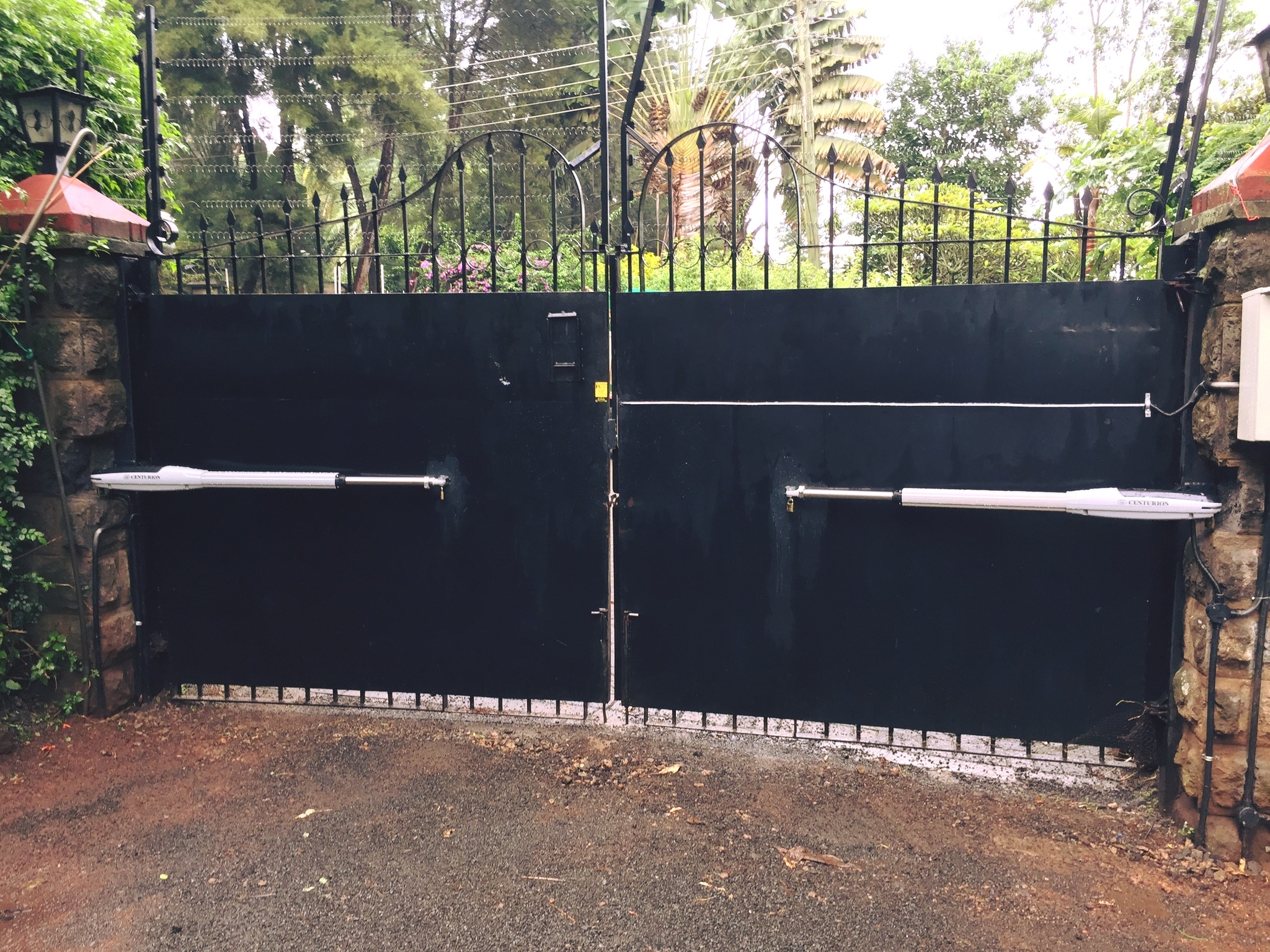 Automatic swing gate with remote access for residential home in Nairobi.