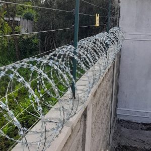 Wall-top electric fence installation for perimeter security in a Nairobi residential compound